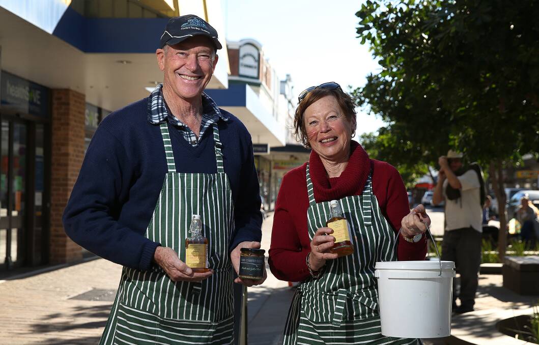HOOKED ON OLIVES: Ian and Kayelene Anderson with some of their products at the Slow Food Earth Market in The Levee.