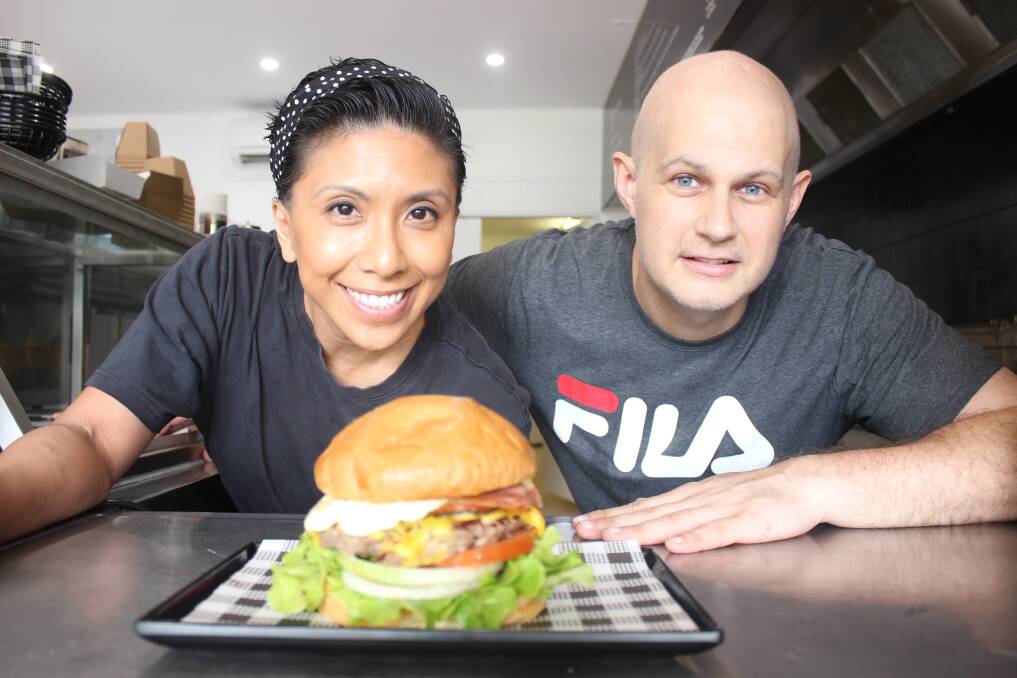 LOCAL TREAT: Burgerfiend"s Marlene and Matt Fulham with one of their award winning burgers. Pictures: Stephen Bisset.