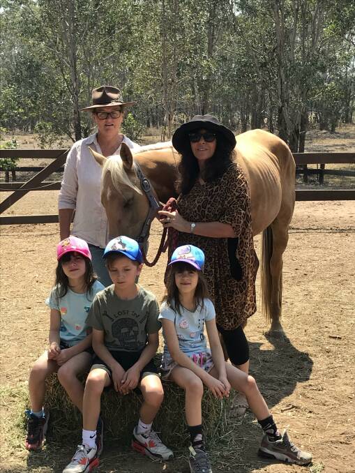 Lovedale Horse Rescue volunteer Kim Murdock and founder Debbie Schwartz, with her children Lara, Dane and Amber and one of the many horses they have rescued.