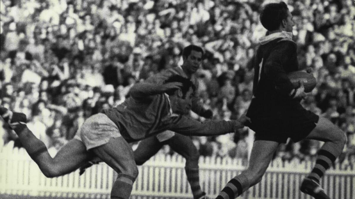 ON THE RUN: Gary Collins stretches the defence playing for Country against City at the Sydney Cricket Ground in 1969.
