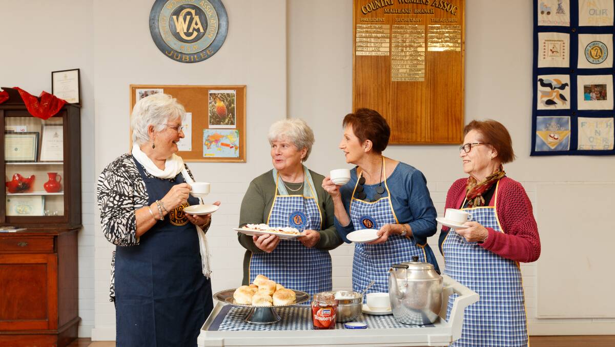 WE ARE BACK: Maitland CWA members Ingrid von Reiche, Barbara Heckman, Susan Morphett and June Heath with a fresh batch of scones baked by Barbara at the Maitland CWA Hall. Picture: Max Mason-Hubers 