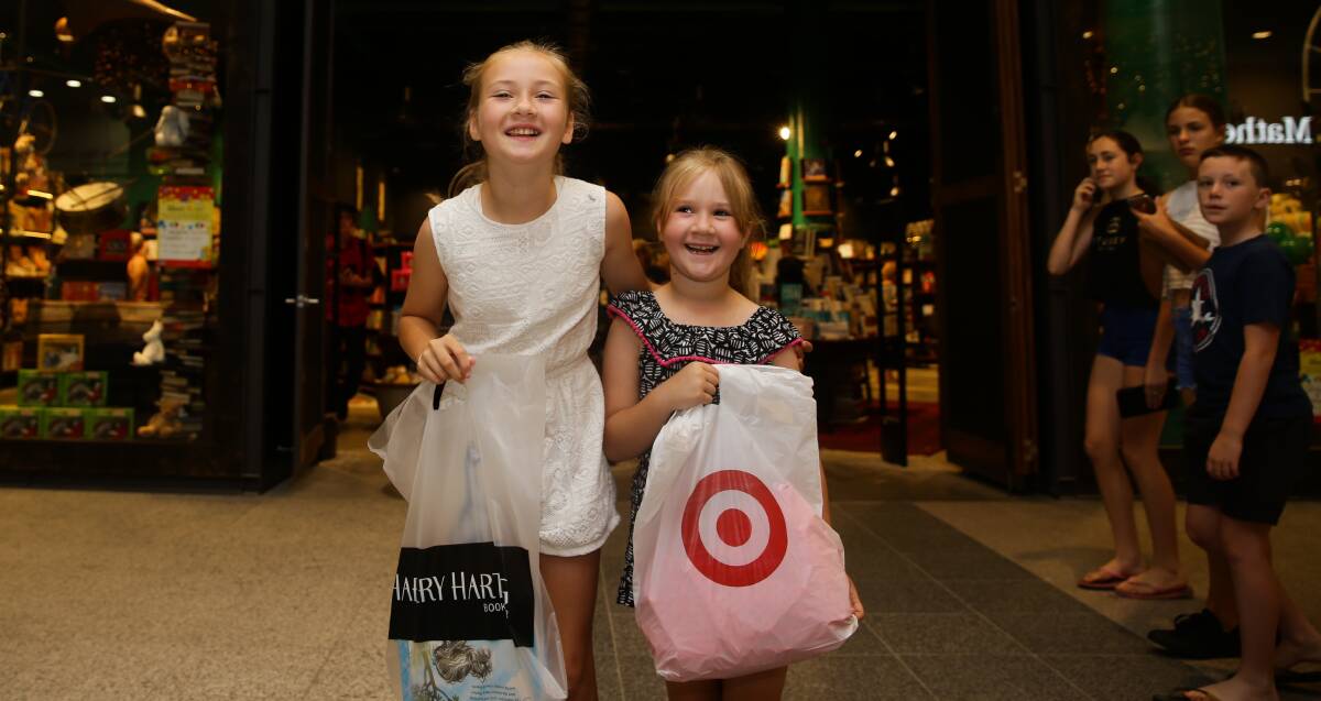 Super shoppers: Sophie, 9, and Anna Stanton, 6, were two of the thousands of shoppers who hit the revamped Stockland Green Hills over the weekend. Picture: Jonathan Carroll