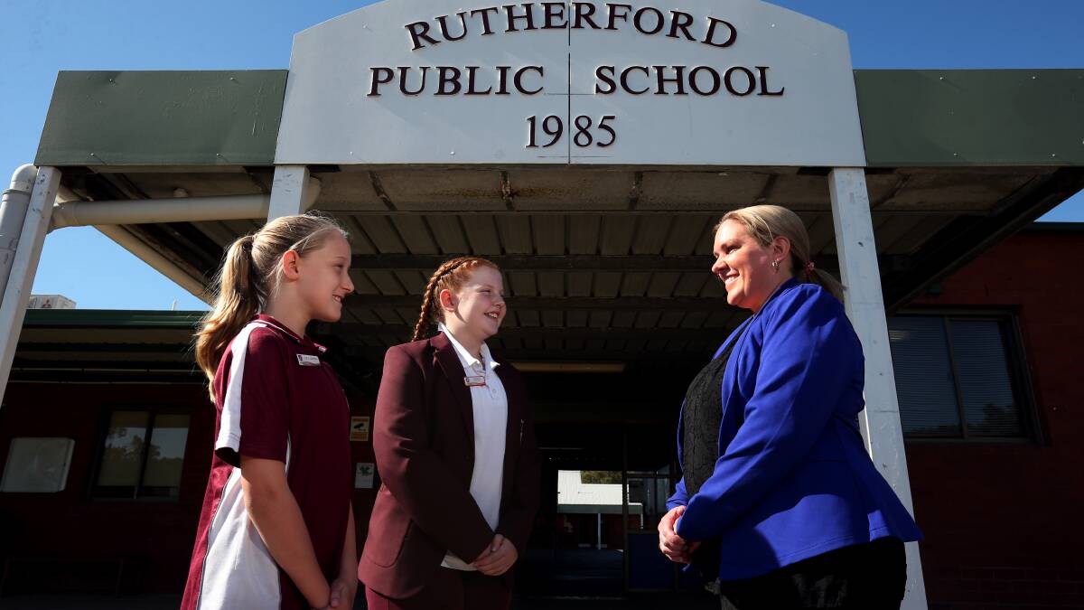 CONCERN: Rutherford Public School's relieving deputy principal Candice Morphett with students Hannah Kerry, left, Pippa McIntosh, both 11. Picture: Simone De Peak.
