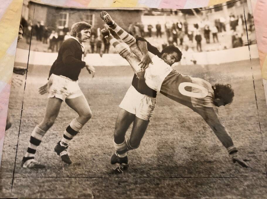 NOW THAT'S A SPEAR: Maitland winger Merv Wright in a familiar pose, burying an opposition forward into the turf at Newcastle Sportsground.