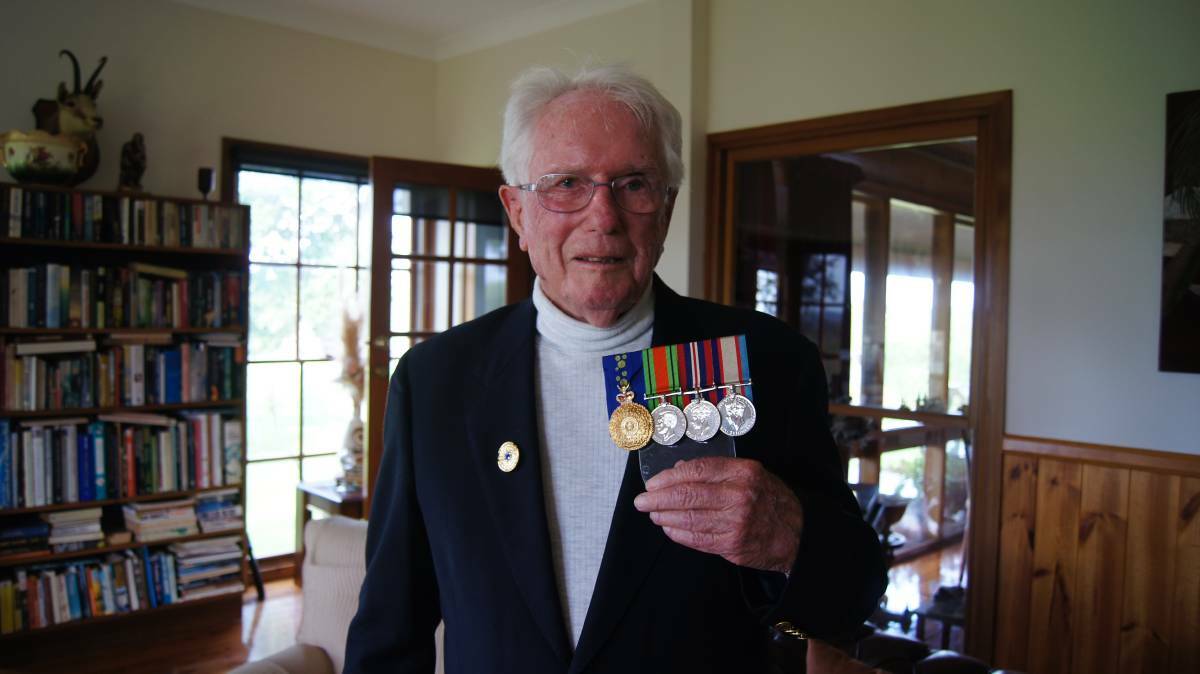 Dr Paul Moffitt with his medals.