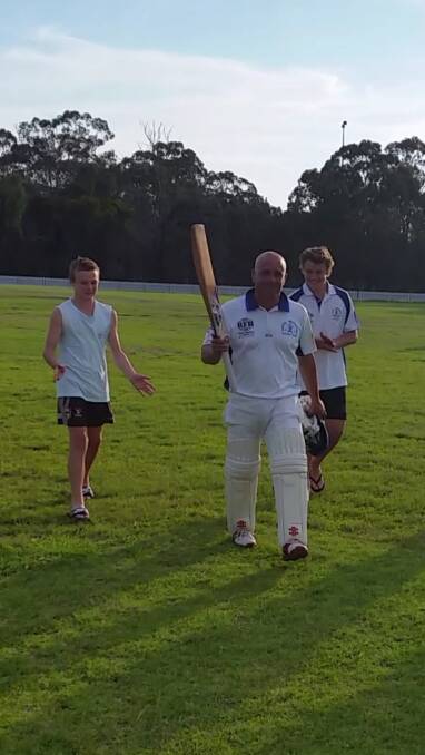 FAMILY AFFAIR: An emotional Greg Andrews leaves the field with his two sons after his inspirational match-winning century for Greta-Branxton.
