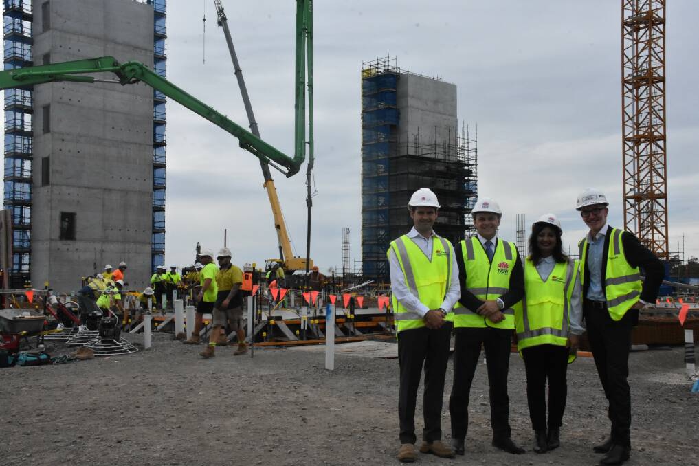 MILESTONE: Health Infrastructure's senior project director Gavin Thomspon, Liberal MLC Taylor Martin, Maitland councillor Kanchan Ranadive and Multiplex regional manager Daniel Murphy at the slab pour. 