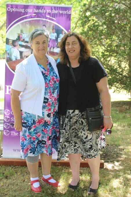 Sue Bartlett and fellow volunteer Helen Colla at Palms Australia's volunteer orientation course in Burradoo, NSW.