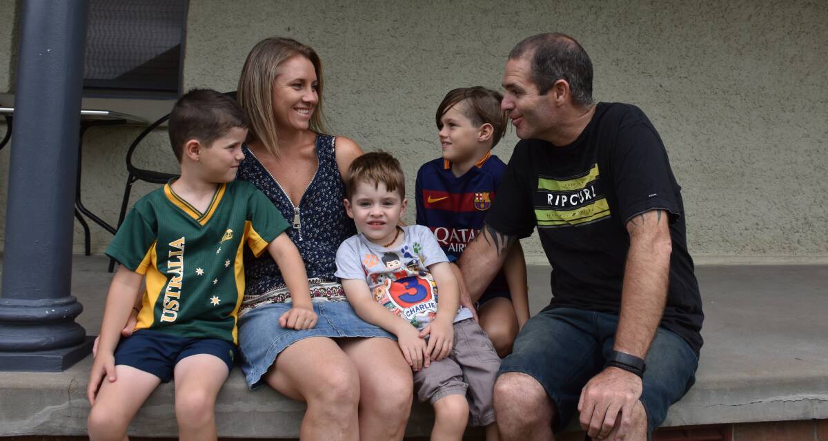 Family's fight: Riley, Sebastian and Preston with their parents Monique and Brett at their East Maitland home. Picture: Lachlan Leeming