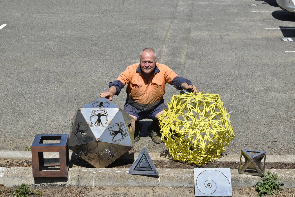 Steel work: Bill Cummins with the five pieces which will be on display at Professor Jon Borwein's commemoration. Picture: Lachlan Leeming. 