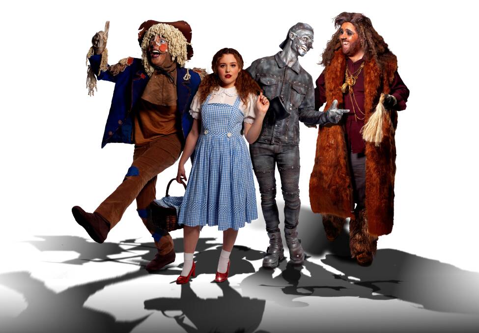 WIZARDRY: Dorothy surrounded by the Scarecrow, Tinman and Lion. 