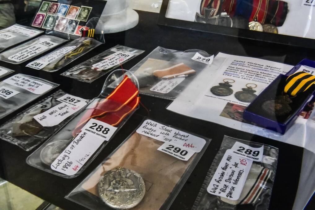 UNDER THE HAMMER: Some of the many items of Nazi memorabilia up for sale at Armitage Auctions on Wednesday. Picture: Neil Richardson