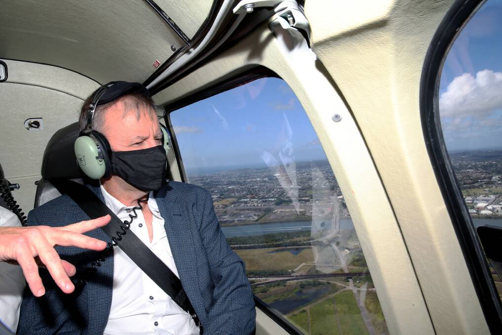 Labor leader Anthony Albanese flies over Newcastle on Monday. Picture: Peter Lorimer