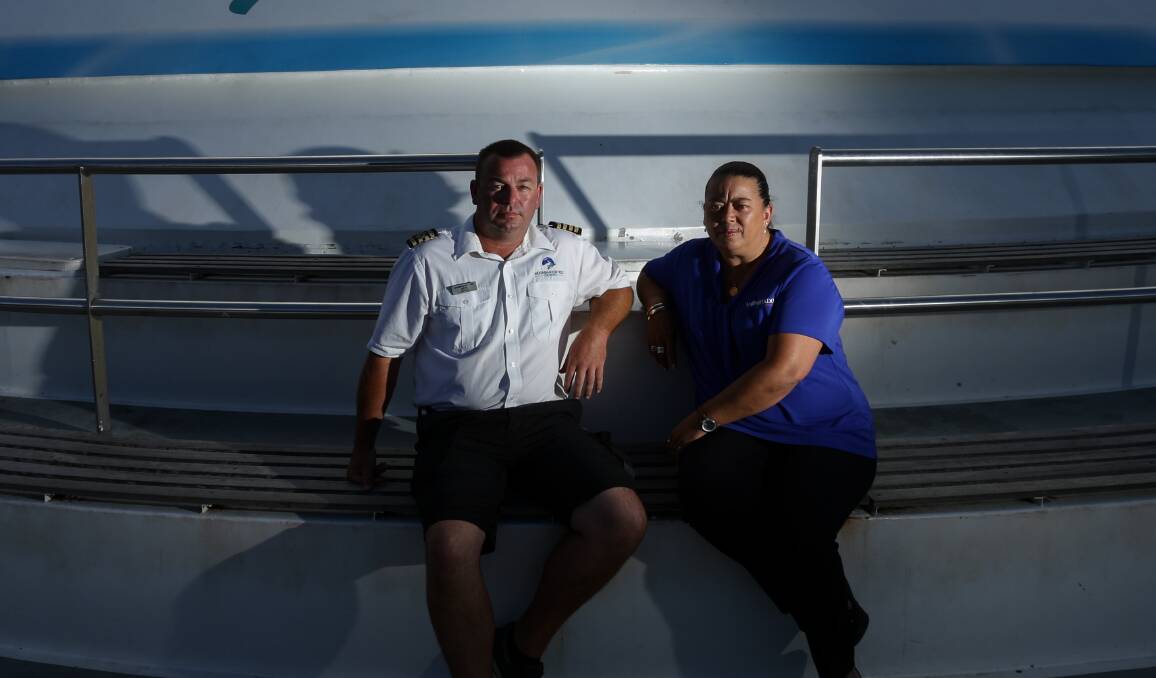 TROUBLED WATERS: Moonshadow-TQC Cruises business development manager Mel Turner and captain Ben Lupton at Nelson Bay on Friday. The company has lost more than 5000 overseas customers due to the coronavirus. Picture: Jonathan Carroll