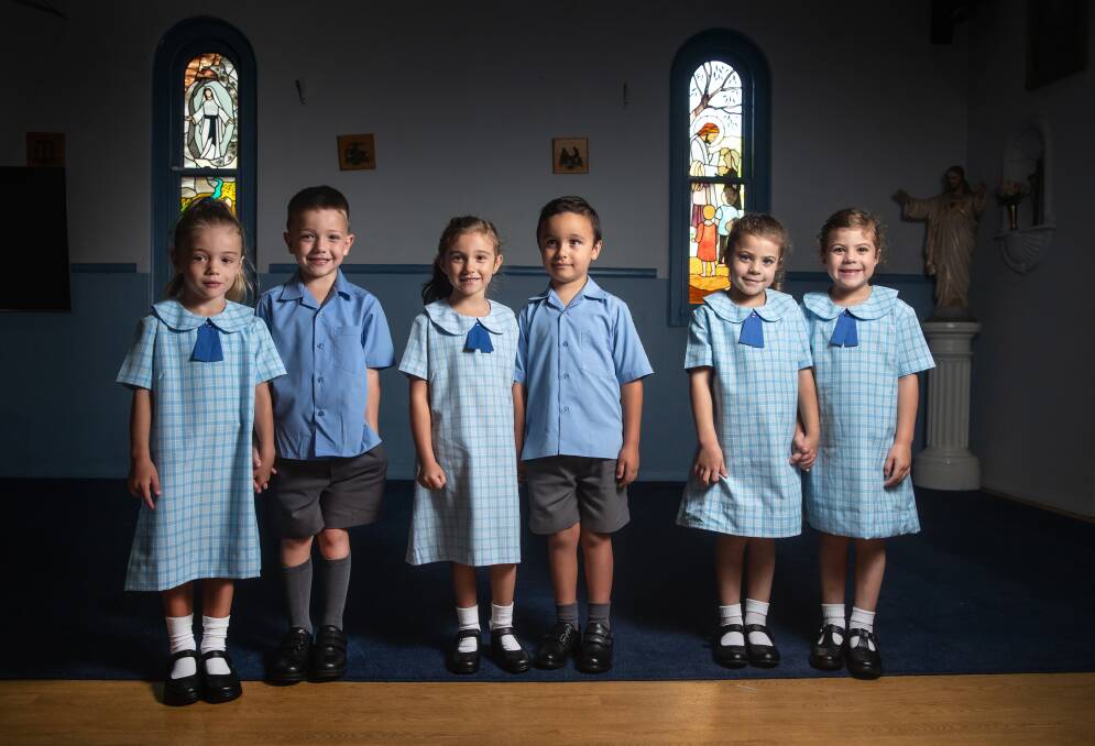 Twinning: Three sets of twins are starting kindergarten at Our Lady of Lourdes Primary School in Tarro on Tuesday. Pictured from left to right, Willow and Nate Stewart, 6; Charlotte and Luca Coleman, 5; and identical twins Charlotte and Audrey Lawton, 5. Picture: Marina Neil