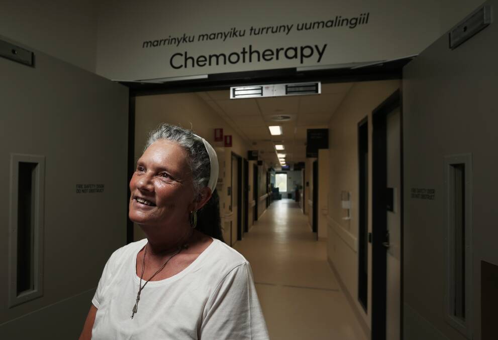 Welcome: Aunty Sharon Edgar-Jones stands at the entrance of the new Maitland Hospital's chemotherapy department. The indigenous translation is 'Place for making the unwell body well'. Picture: Simone De Peak