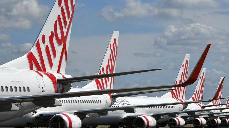 Private equity firm Bain Capital makes shortlist bid for Virgin Australia
