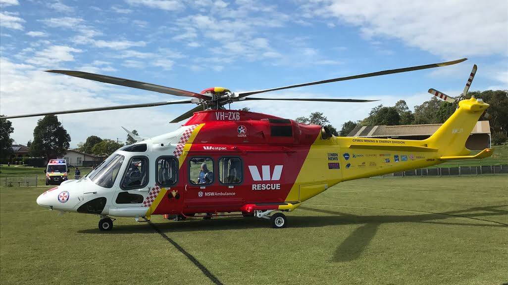 The Westpac rescue helicopter at Norm Chapman Oval at Rutherford. It has flown a 62-year-old man to John Hunter Hospital after he was crushed by a two-tonne van. Picture: Hunter Westpac rescue helicopter service.