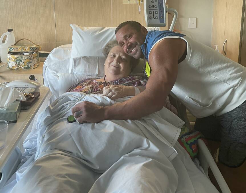 Robbie O'Davis in hospital with his mum Marg.