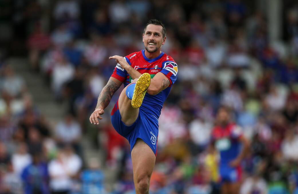 Knights skipper Mitchell Pearce with a clearing kick.