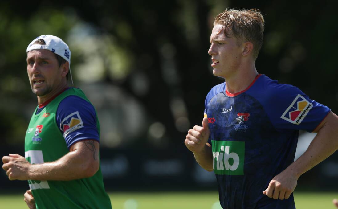 Master and apprentice: Young playmaker Phoenix Crossland trains alongside his mentor Mitchell Pearce. Crossland will make his NRL debut off the bench on Saturday.