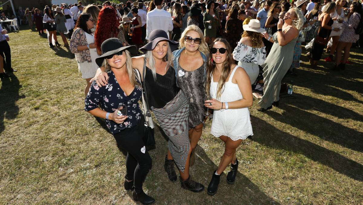 SUNSHINE: Nicole Smith, Lisa Barry, Carissa Dyke and Carli Ford ready to get on the dancefloor at the long lunch at Tatler Wines on Saturday.