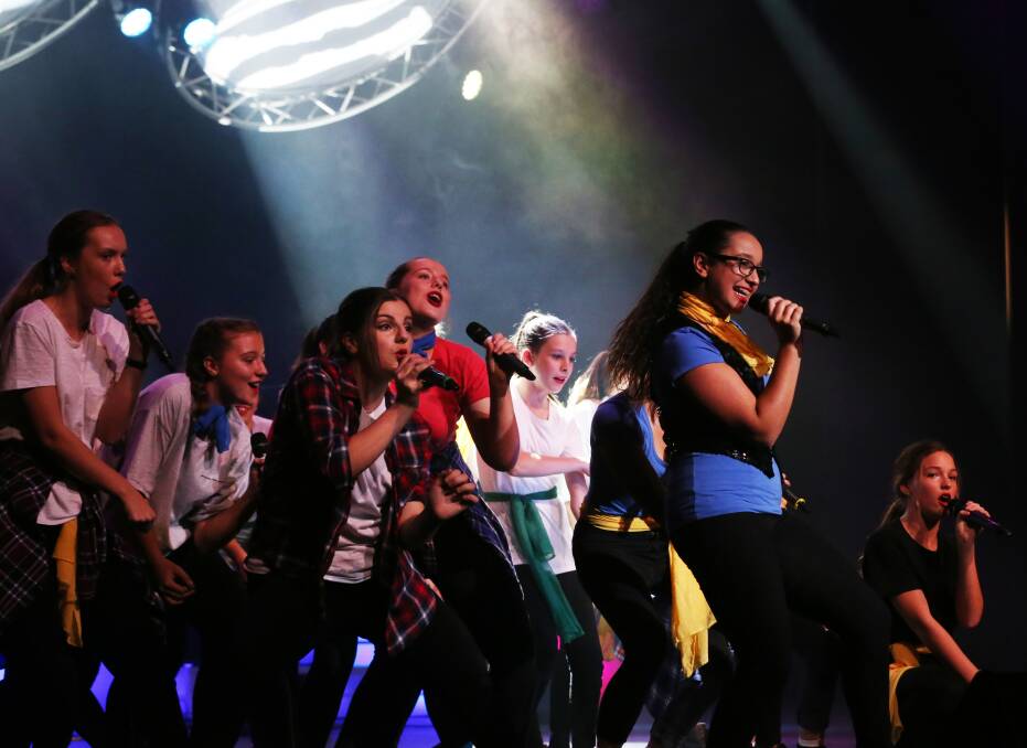 On point: Students from St Pius X Adamstown performed Pitch Perfect's The Barden Bellas' finals piece to an audience of about 1000 students from across the diocese. Picture by Simone De Peak
