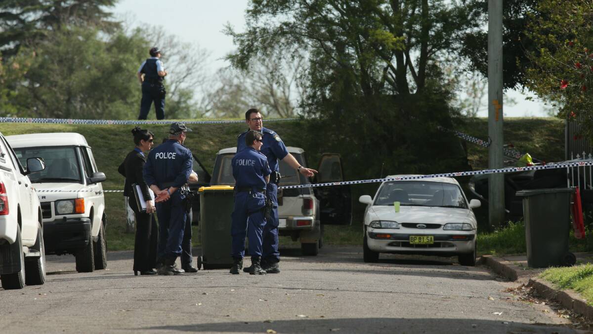Police carry out investigations on Bella Drive, Horseshoe Bend, on Friday. Picture: Simone De Peak
