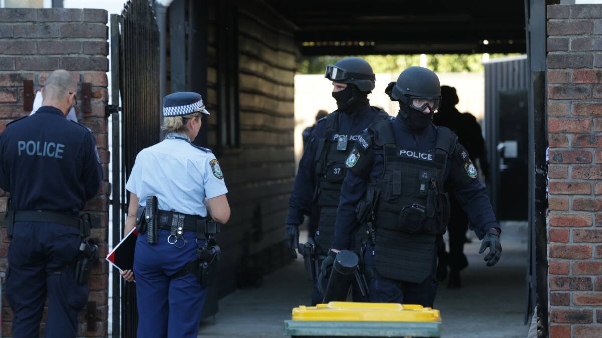 Police raid the Chin Chen Street clubhouse of the Nomads outlaw motorcycle gang. Picture: Newcastle Herald