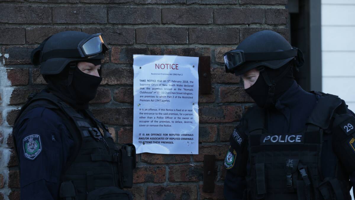 GANGBUSTERS: Strike Force Raptor detectives at the Islington headquarters of the Nomads bikie gang last week. Police have announced a new strike force to tackle Hunter bikies.