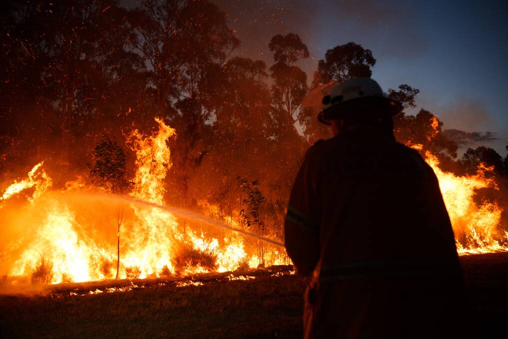 INFERNO: Firefighters battle intense bushfires at Richmond Vale and Black Hill on Wednesday. Pictures: Max Mason-Hubers, Sage Swinton, MJF Productions