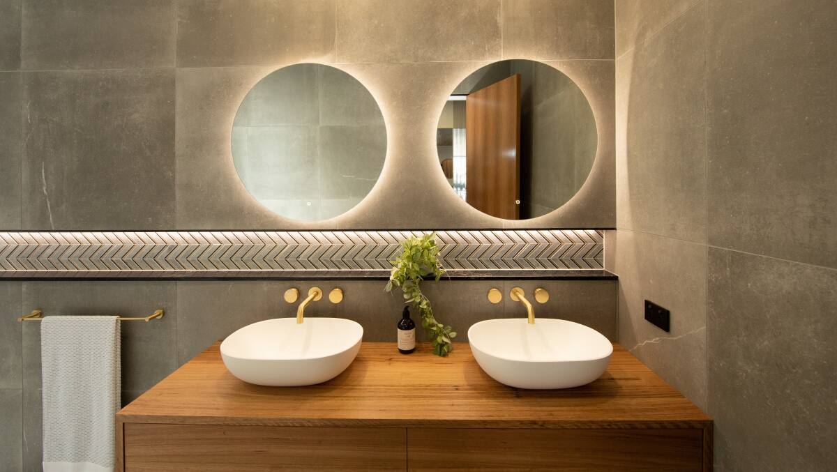 Budget hacks: You can still give your guests a memorable bathroom experience by lodging a luxe LED mirror above your vanity. 