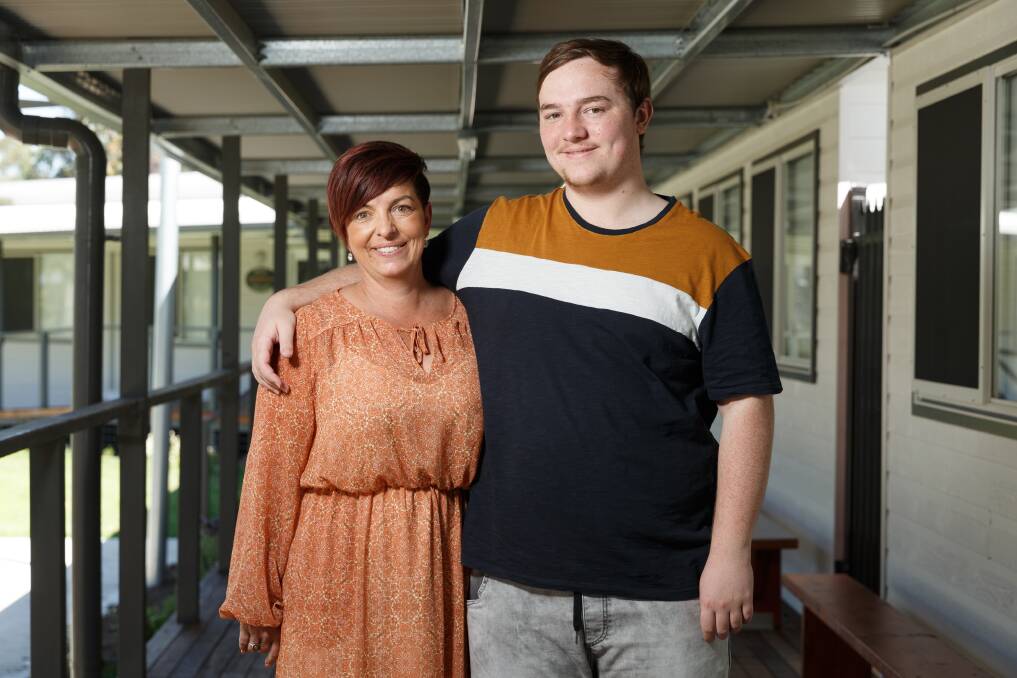 Happier days: Michelle Finlay and son Thomas Finlay, 16, who is the oldest student at Hunter Aspect high school. Picture: Max Mason-Hubers 