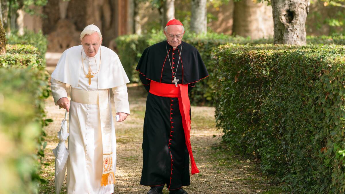 Anthony Hopkins, left, as Pope Benedict (formerly Joseph Ratzinger) and Jonathan Pryce as Cardinal Jorge Bergoglio, later Pope Francis in The Two Popes. Picture: Peter Mountain/Netflix