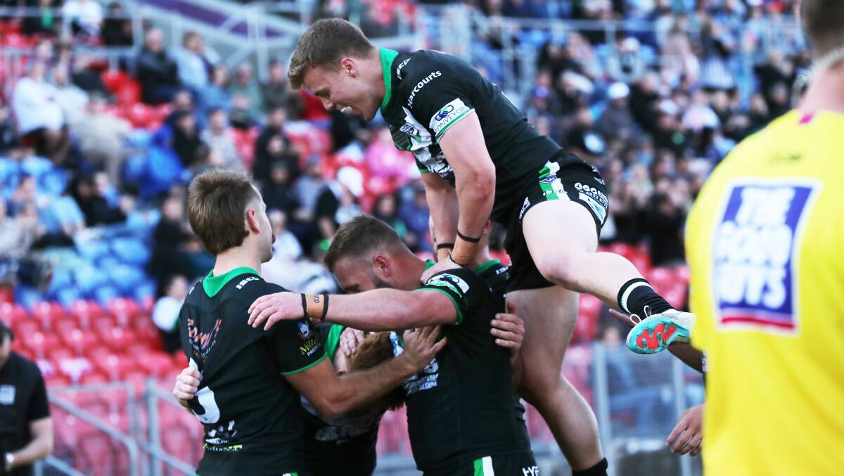 Maitland players celebrate a try during last year's Newcastle RL grand final. Picture by Peter Lorimer