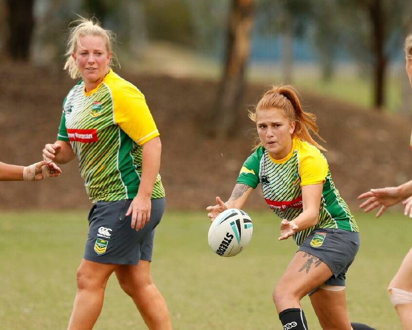 REPRESENTATIVES: Bec Young and Caitlin Moran training with the Jillaroos before last year's World Cup.
