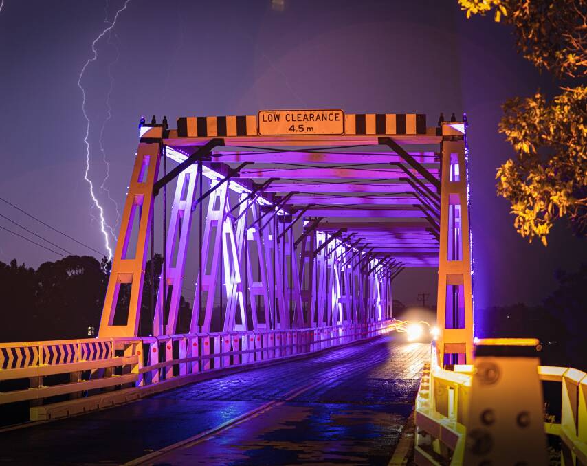 UP IN LIGHTS: Morpeth bridge has been illuminated as the town celebrates 200 years. Official commemorations will go ahead next year. Picture: Maitland City Council