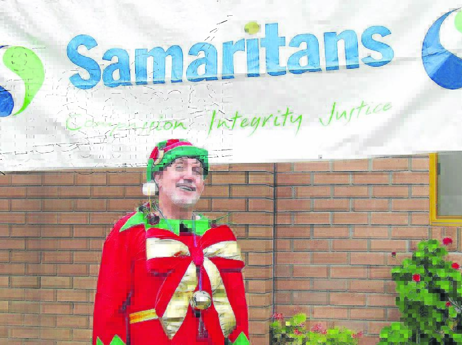 ON THE SHELF: Singleton's Gary Holland said he took his spot as greeting elf at Singleton's Samaritans lunch on Christmas despite the event not proceeding this year.