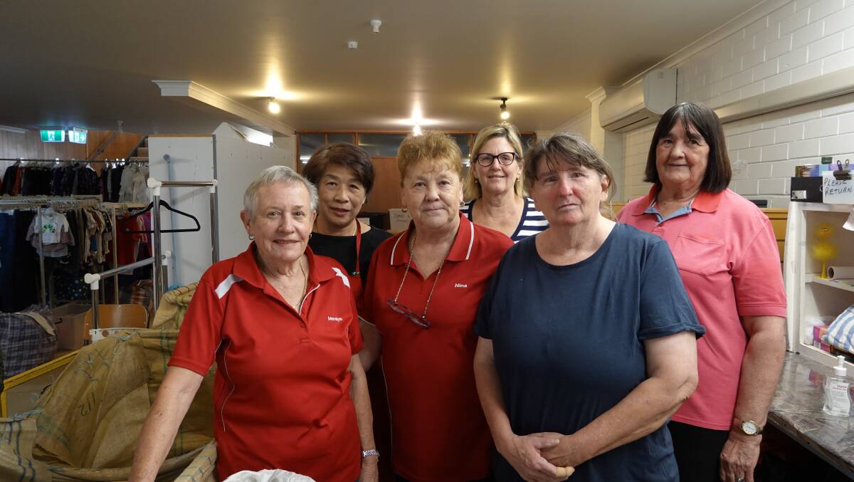 Merelyn, Ning, Nina, Anthea, Jenny, and Patricia are volunteers at the Salvation Army in Griffith. They sift through hundreds of second-hand items each day. Photo: Monty Jacka