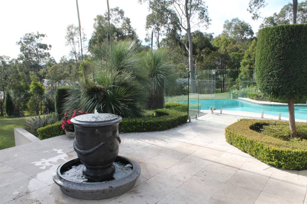 Poolside structure: The Cornish family garden at East Maitland showcases formal hedging at its best.