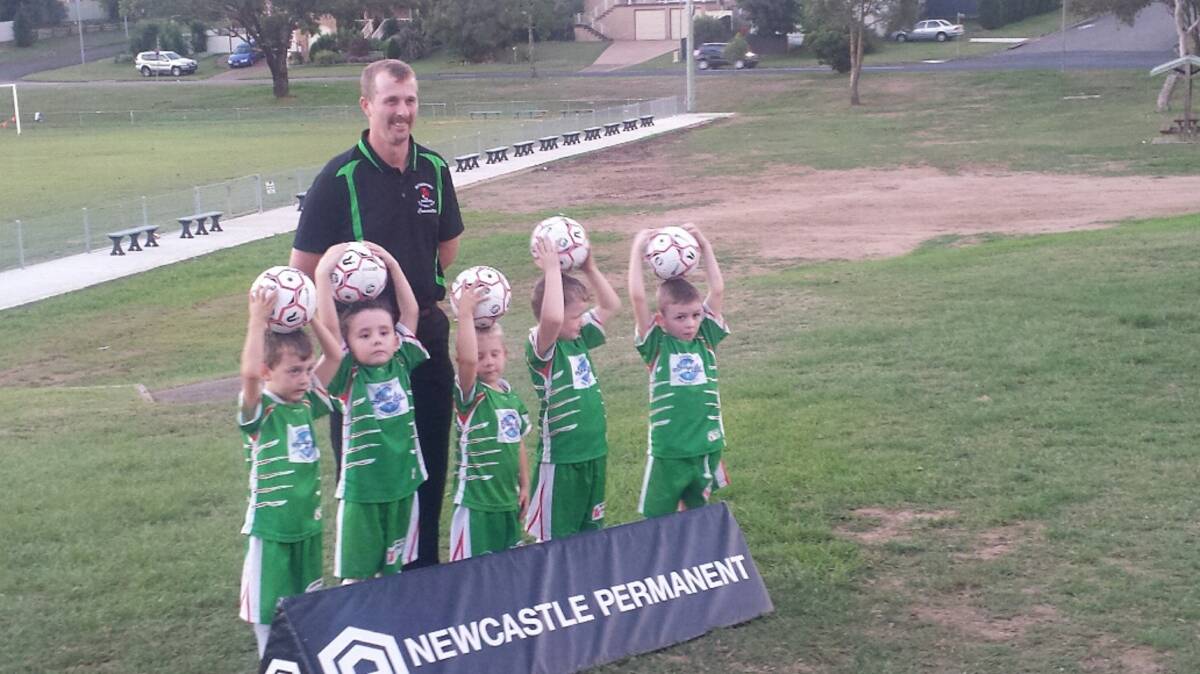 Go the greens: Young players get vital skills training each week at the club and take pride in wearing their green and white strip.