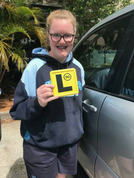 Raring to go: Olivia proudly shows off her L plates which she gained with the support of Connexions.