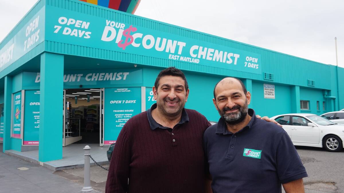 Bigger and better: The Khodary brothers at the new East Maitland Your Discount Chemist store.