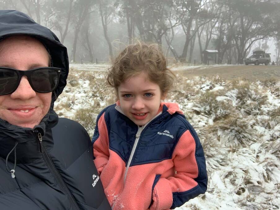 White wonderland: Brittany Daly with her daughter Isabella at Barrington Tops National Park. Photo: supplied. 