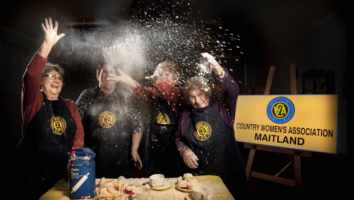 FLOUR POWER: Margaret Harvey, Cynthia Abbott, Barbara Heckman and June Gardner have a flour fight in the CWA Hall. Pictures: Perry Duffin