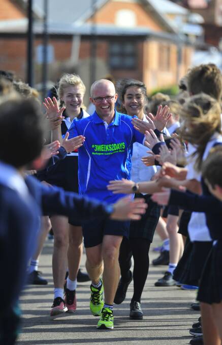 INSPIRED: Michael Eccleston running along the Maitland riverbank to St Peter's high school where he spoke with students. Picture: PERRY DUFFIN