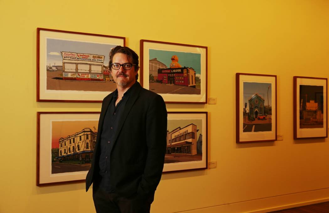 GREETINGS: Trevor Dickinson stands in front of his Greetings from Maitland exhibiton. Picture: SIMONE DE PEAK.