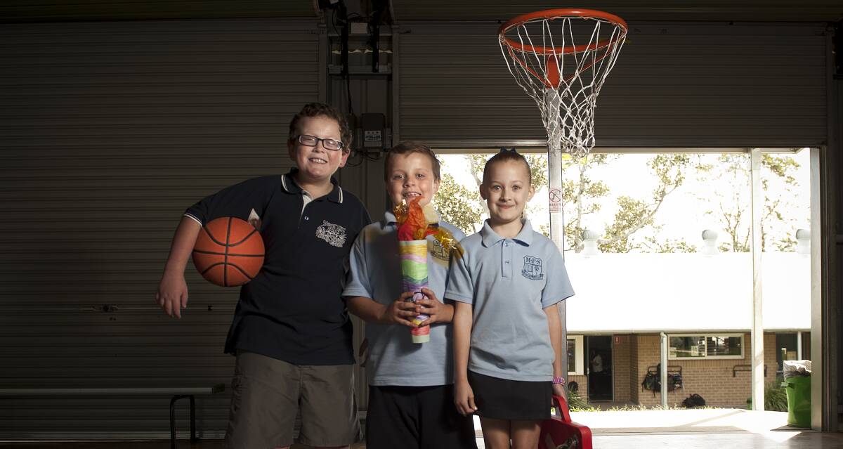 MY WAY: Morpeth Public year six student Tristan Grunsell with year two students Kelan Blinman and Soraya Speering at the school's mini-Paralympics. Picture: Perry Duffin