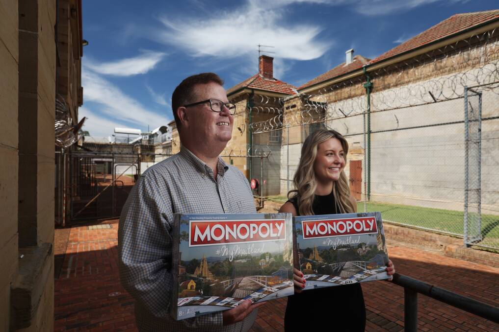 Maitland Mayor Philip Penfold and council officer Caprice Woolley with the release of Maitland Monopoly. Pictures by Simone De Peak