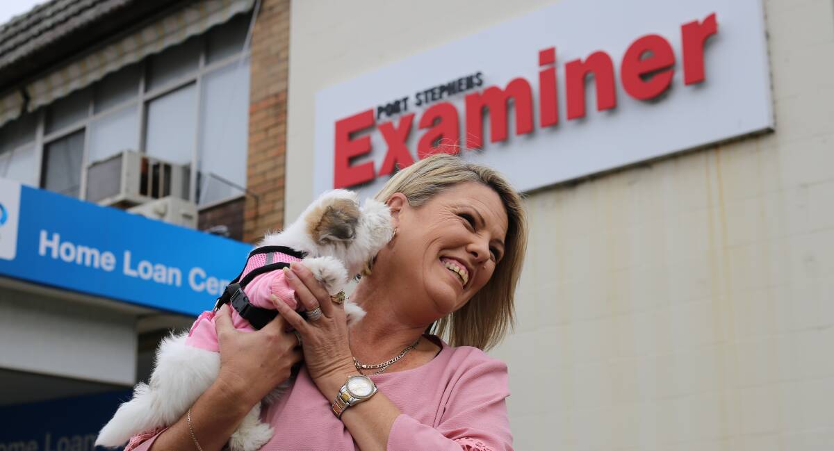 Port Stehens Examiner sales representative Tracey Marjoram with her 9 week old Maltese Shih Tzu, Gidget, at work on Friday for Take Your Dog to Work Day. Picture: Ellie-Marie Watts